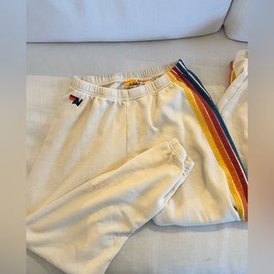 Aviator Nation cream sweatpants with multi-color striping
